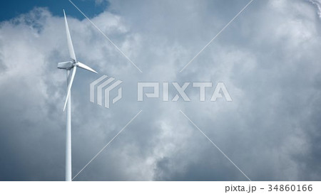 Windmills with blue sky in background 34860166