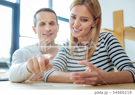 Delighted nice man pointing at the tablet screen 34860219