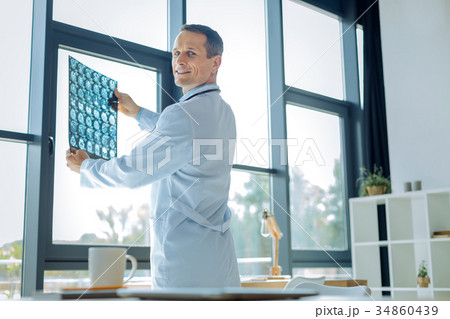 Delighted smart doctor turning to you Delighted smart doctor turning to you 34860439