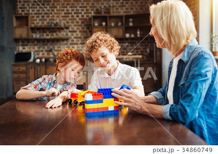 Smart joyful children spending free time with 34860749