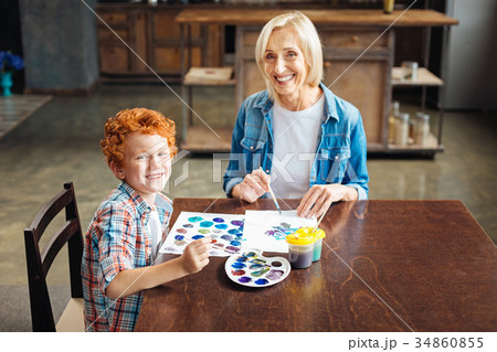 Excited family members grinning broadly into Excited family members grinning broadly into 34860855