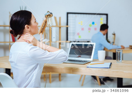 Tired woman having pain in neck 34861096