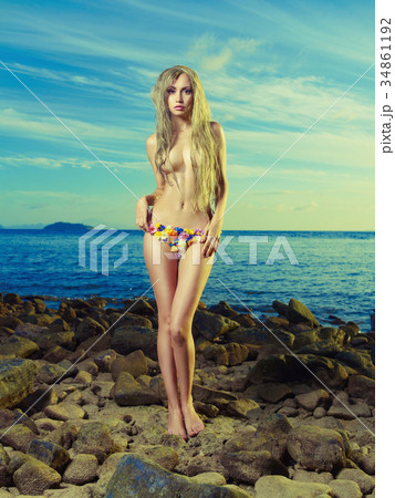 Gorgeous blonde in flower bikini at the sea 34861192