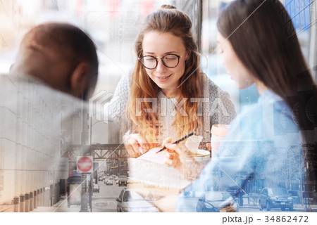 Happy friends talking about career plans Happy friends talking about career plans 34862472