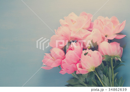 Fresh peonies on blue Fresh peonies on blue 34862639