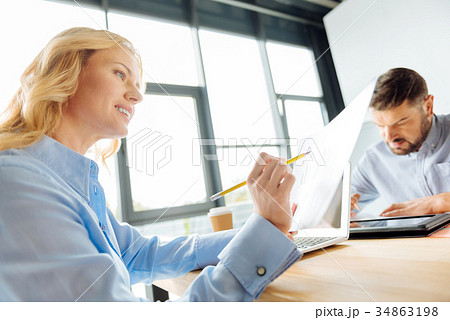Low angle photo of positive woman while reading 34863198