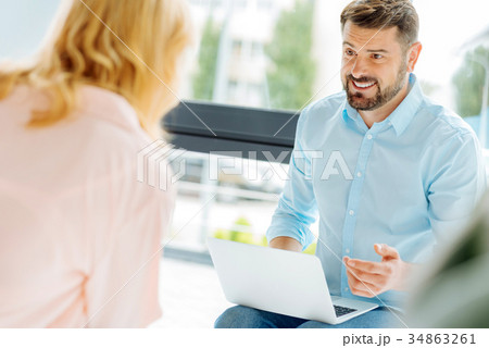 Handsome brunette talking to his partner 34863261