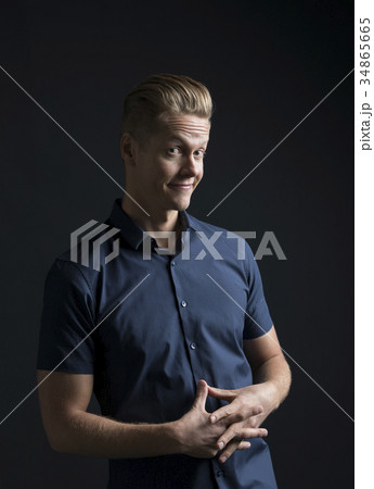 Portrait of man frowning and smiling 34865665