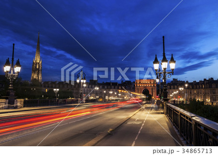 France, Nouvelle-Aquitaine, Bordeaux, Cailhau Gate, Incidental people and cars in long exposure 34865713