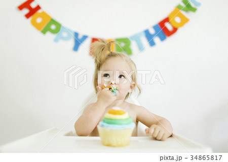 Baby girl (12-17 months) celebrating first birthday Baby girl (12-17 months) celebrating first birthday 34865817