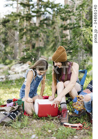 Mother with daughter (8-9) camping in forest 34866140