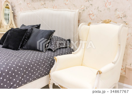 Bed maid-up with clean white pillows and bed sheet Bed maid-up with clean white pillows and bed sheet 34867767