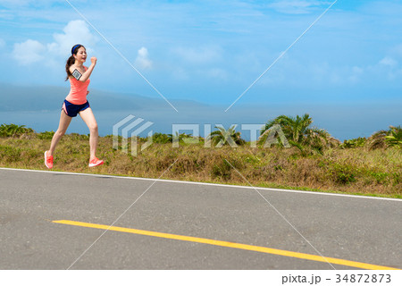 attractive beauty girl athlete running on road attractive beauty girl athlete running on road 34872873
