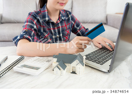attractive beauty housewife holding credit card 34874654