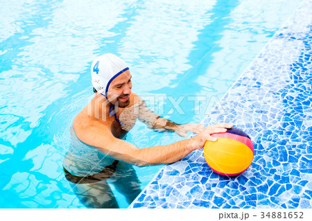 Water polo player in a swimming pool. Water polo player in a swimming pool. 34881652