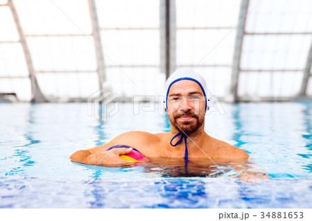 Water polo player in a swimming pool. Water polo player in a swimming pool. 34881653