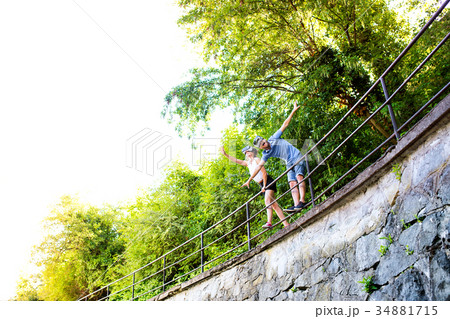 Couple with VR goggles on a walk in town. Couple with VR goggles on a walk in town. 34881715