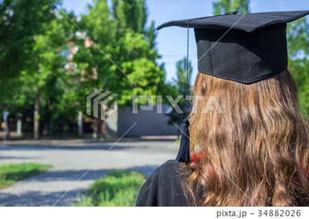 back of graduate on graduation day back of graduate on graduation day 34882026
