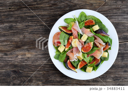 salad of spinach, figs, prosciutto, cheese 34883411