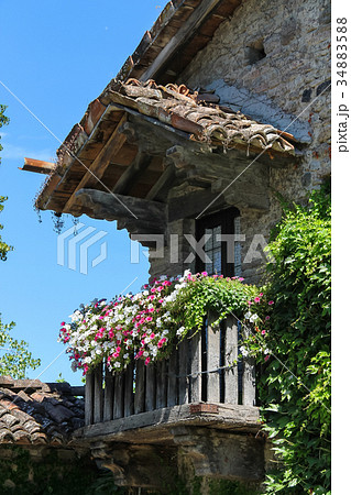 Old building with wooden balcony  34883588