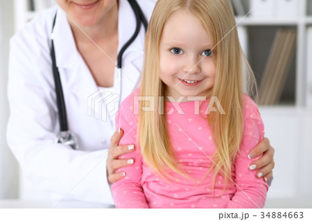 Happy cute baby  after health exam at doctor' 34884663