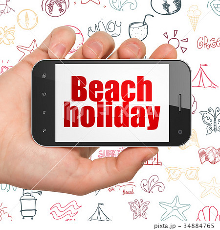 Travel concept: Hand Holding Smartphone with Beach 34884765