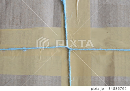 parcel rope tying around brown postbox 34886762