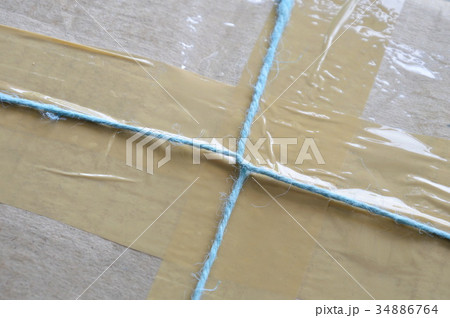 parcel rope tying around brown postal box parcel rope tying around brown postal box 34886764