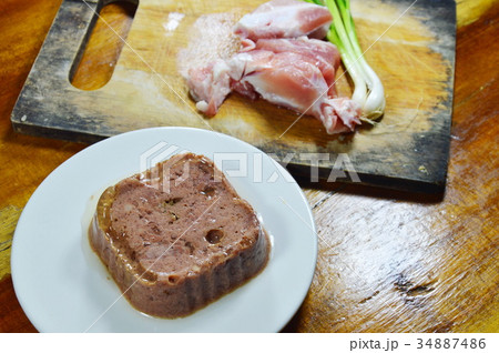 dog premium wet food and fresh raw pork on block dog premium wet food and fresh raw pork on block 34887486