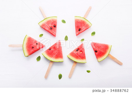 Watermelon slice popsicles on white background Watermelon slice popsicles on white background 34888762