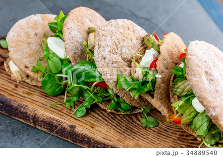 Pita sandwiches stuffed with chicken, vegetables 34889540