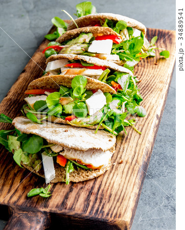 Pita sandwiches stuffed with chicken, vegetables 34889541