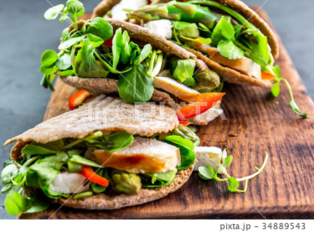 Pita sandwiches stuffed with chicken, vegetables 34889543