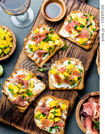 Toasts with cream cheese, ham jamon serrano and 34889586