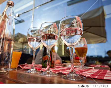 Row of pure drinking water glasses at summer Row of pure drinking water glasses at summer 34893403