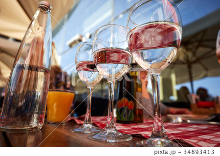 Row of pure drinking water glasses at summer 34893413