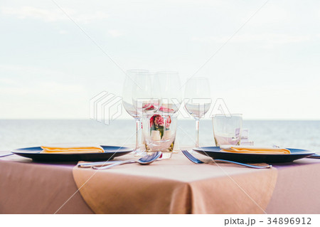 Romantic dining table setting with wine glass and other Romantic dining table setting with wine glass and other 34896912