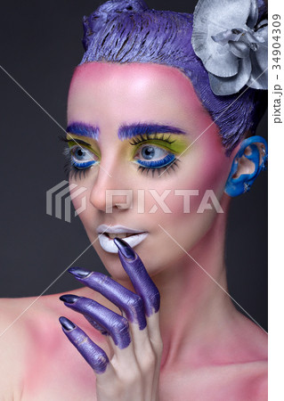 Creative portrait of woman with art make-up. 34904309