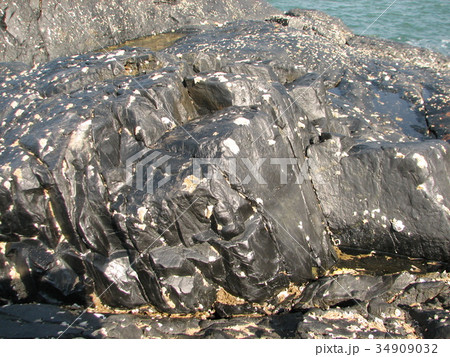 Grey natural stone texture photo background. Grey natural stone texture photo background. 34909032