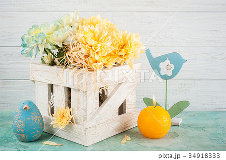 Blue and yellow chrysanthemum in white wooden box 34918333