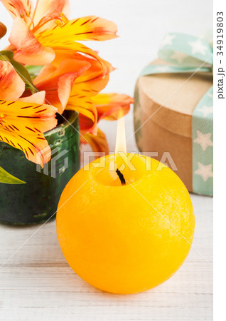 Arrangement of orange lily flowers in green pot Arrangement of orange lily flowers in green pot 34919803