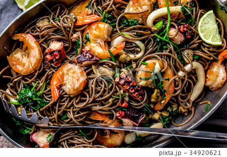 Buckwheat noodles with seafood - shrimps, octopus Buckwheat noodles with seafood - shrimps, octopus 34920621
