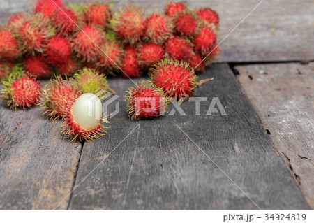 rambutan sweet fruit fresh on wood background 34924819