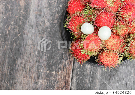 rambutan sweet fruit fresh in plate on wood  34924826