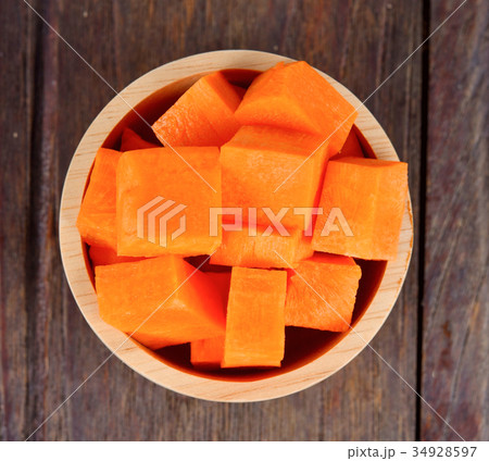 Carrot pieces on wood Carrot pieces on wood 34928597