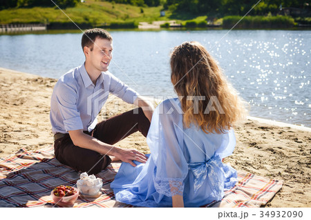 happy couple resting on beach happy couple resting on beach 34932090