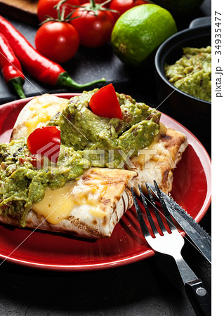 Mexican chimichanga with guacamole dip 34935477