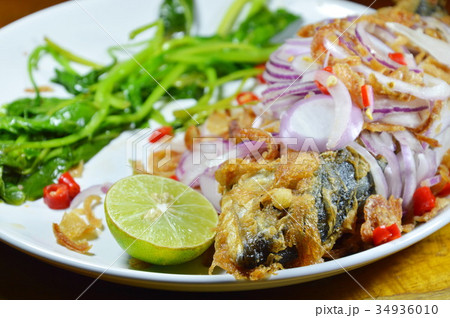 deep fried mackerel with egg  salad on dish 34936010