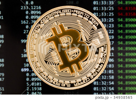 Golden Bitcoin cryptocurrency yellow coin on a Golden Bitcoin cryptocurrency yellow coin on a 34938565