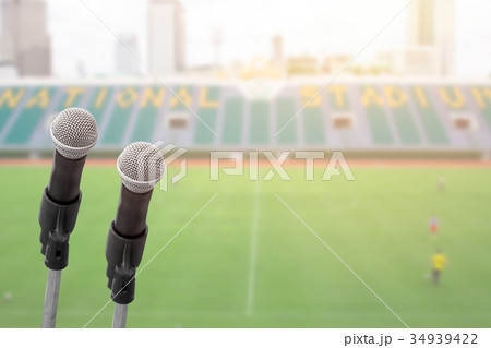 Microphone for commentator with sport blur back 34939422